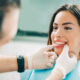 Dentist checks patient after Botox treatment